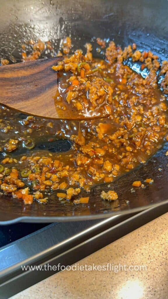 Sweet chili calamansi udon sauce in a wok