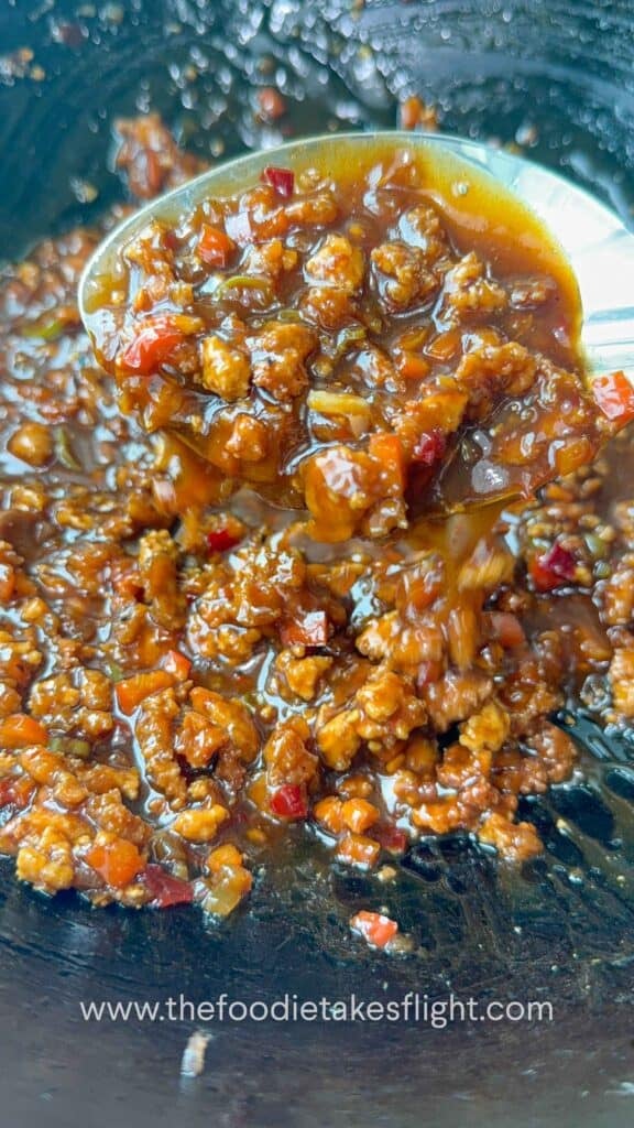 Sweet chili calamansi udon sauce in a wok