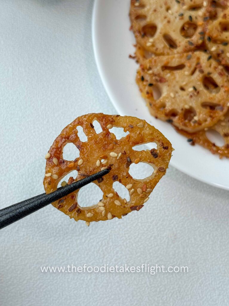 Pan-fried lotus root slices coated in lemon miso sauce
