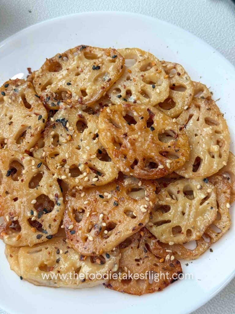 Pan-fried lotus root slices coated in lemon miso sauce