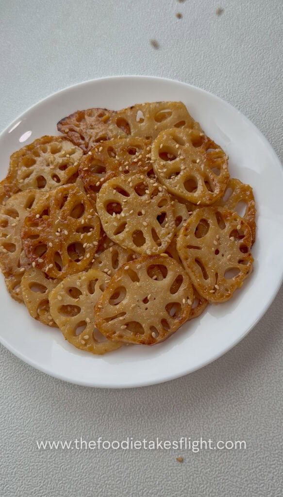 Pan-fried lotus root slices coated in lemon miso sauce