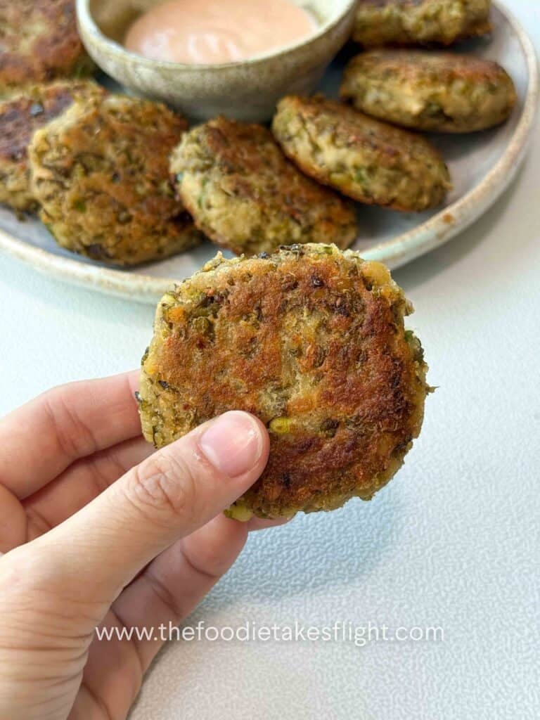 golden pan-fried mung bean patties served with dipping sauce on the side