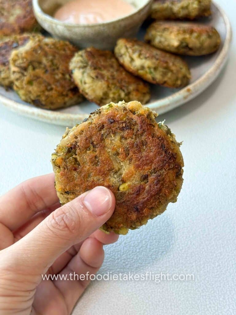 golden pan-fried mung bean patties served with dipping sauce on the side