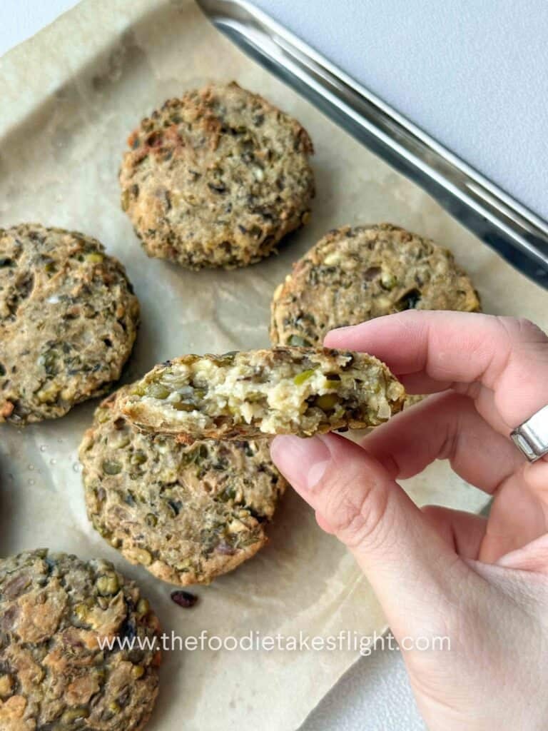 baked mung bean patties on a lined baking tray