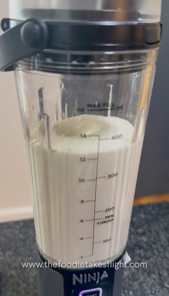 Silken tofu being blended into a smooth creamy sauce