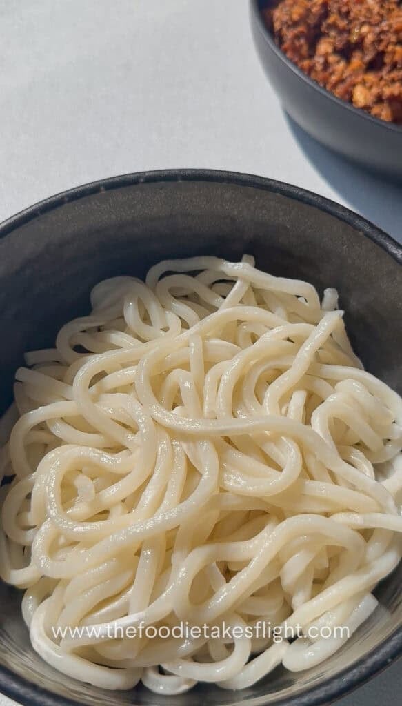 cooked udon noodles in a bowl
