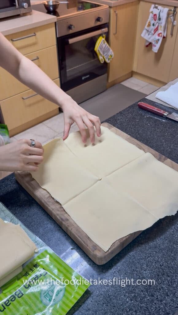tofu or beancurd sheets / skin laid out on a cutting board