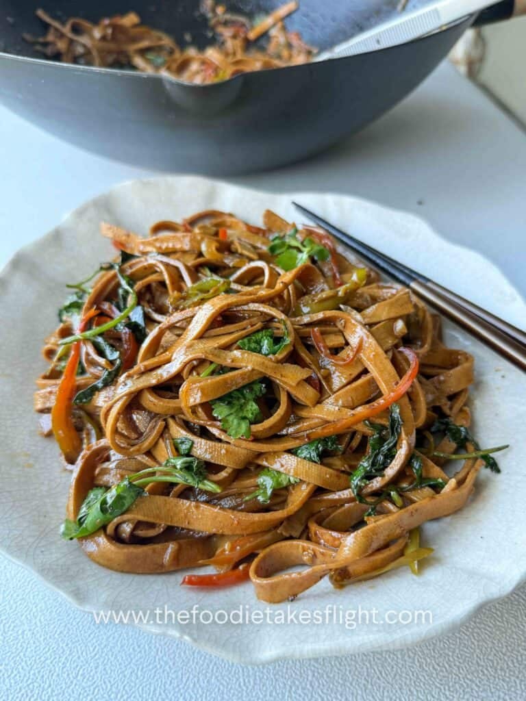 stir-fried beancurd sheets served in a bowl with cilantro