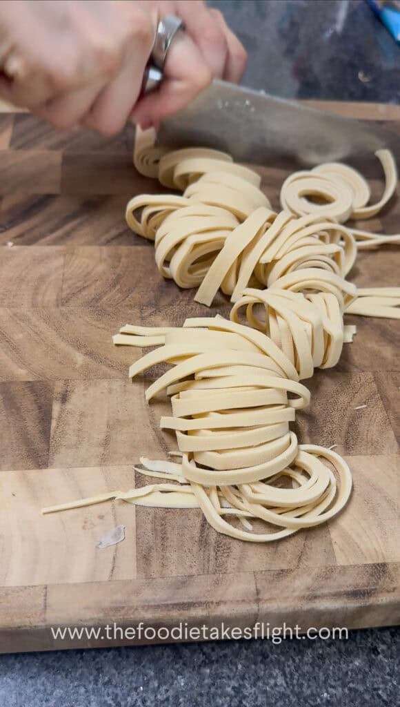 slicing rolled up beancurd skin or sheets into noodles