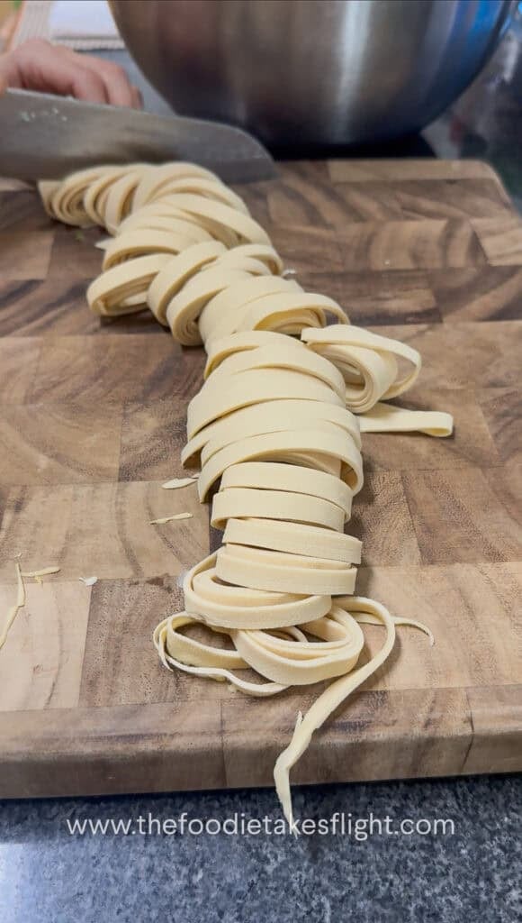 slicing rolled up beancurd skin or sheets into noodles