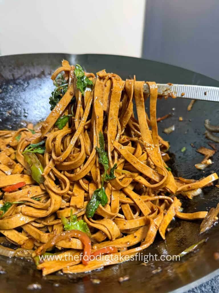 chewy tofu skin noodles stir-fried in a savory sauce