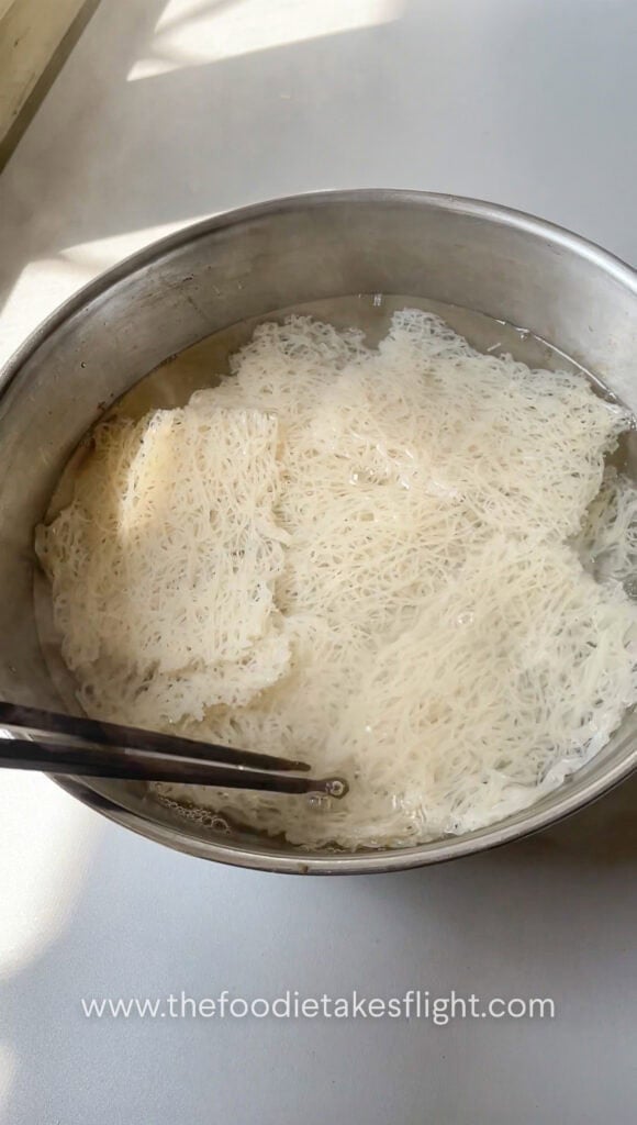 soaking banh hoi in hot water