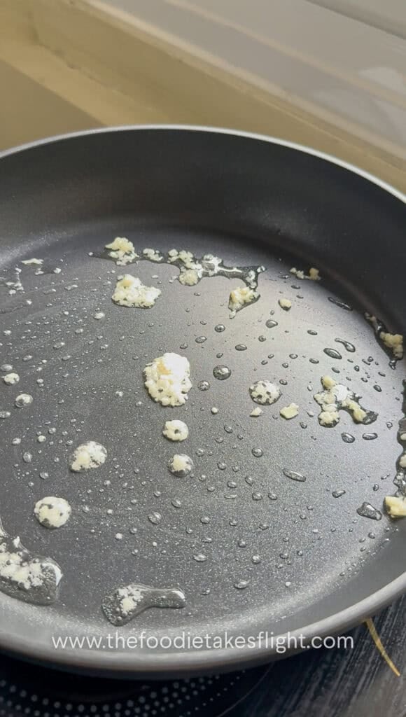 sautéing minced garlic in oil
