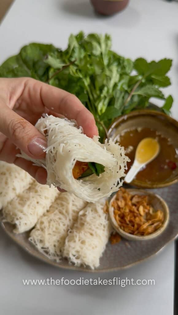 Hoisin tofu wrapped with banh hoi, lettuce, and fresh herbs
