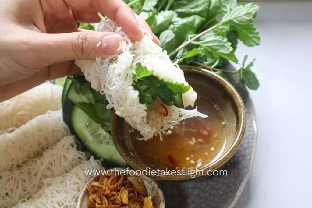 Hoisin tofu wrapped with banh hoi, lettuce, and fresh herbs