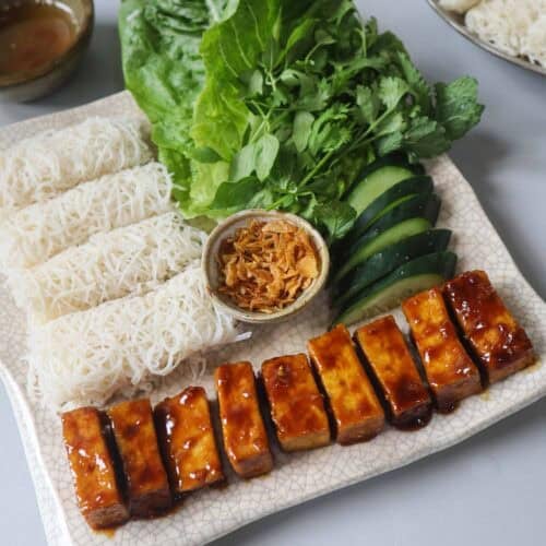 Banh hoi platter with hoisin tofu, lettuce, fresh herbs, and vegan nuoc cham