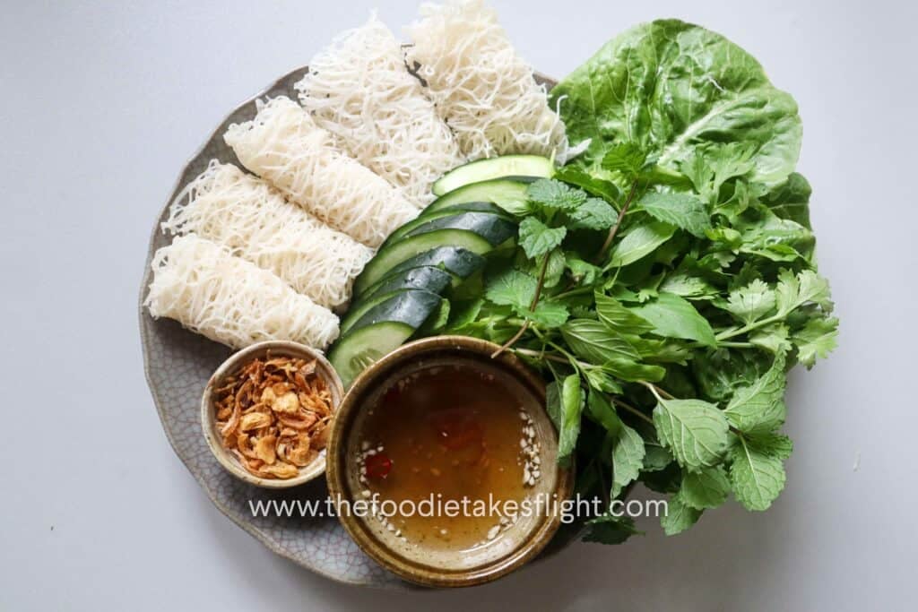 Banh hoi platter with hoisin tofu, lettuce, fresh herbs, and vegan nuoc cham
