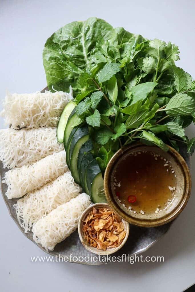 Banh hoi platter with hoisin tofu, lettuce, fresh herbs, and vegan nuoc cham