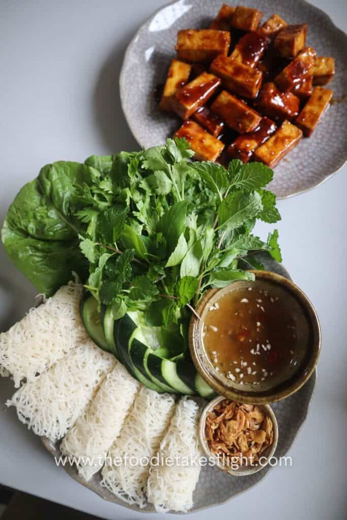 Banh hoi platter with hoisin tofu, lettuce, fresh herbs, and vegan nuoc cham