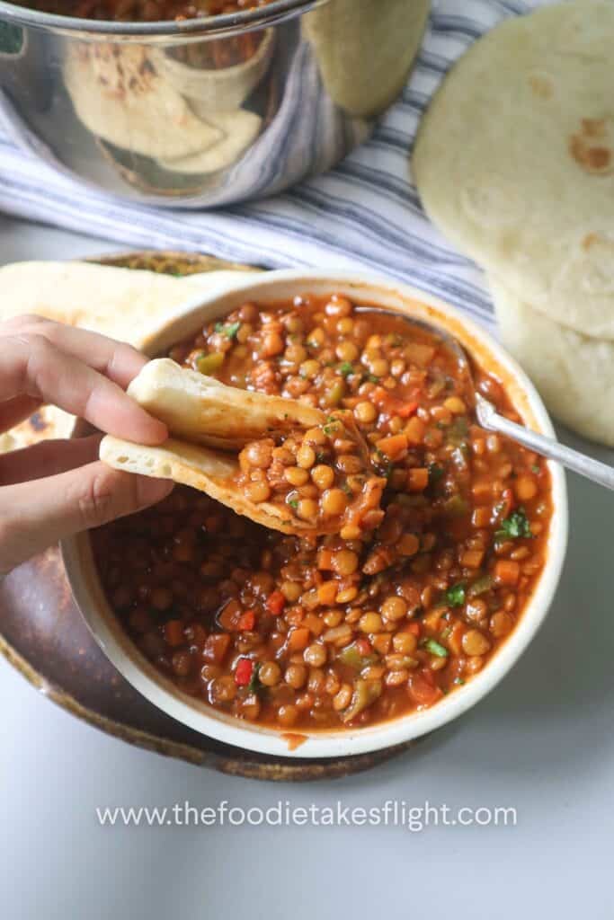 lentil soup with a slice of homemade pita