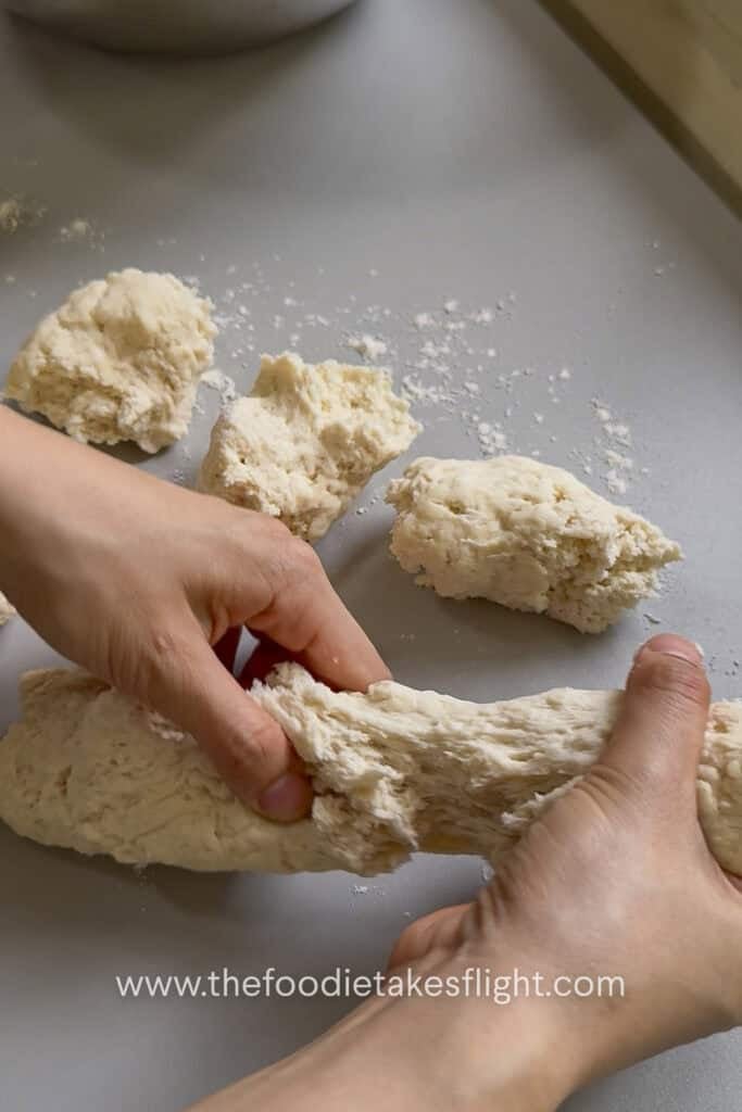 Pita dough divided into small balls before rolling into flatbreads