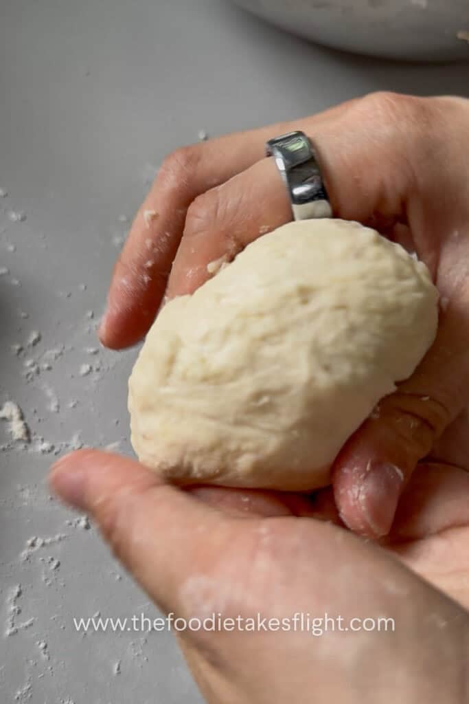 Pita dough divided into small balls before rolling into flatbreads
