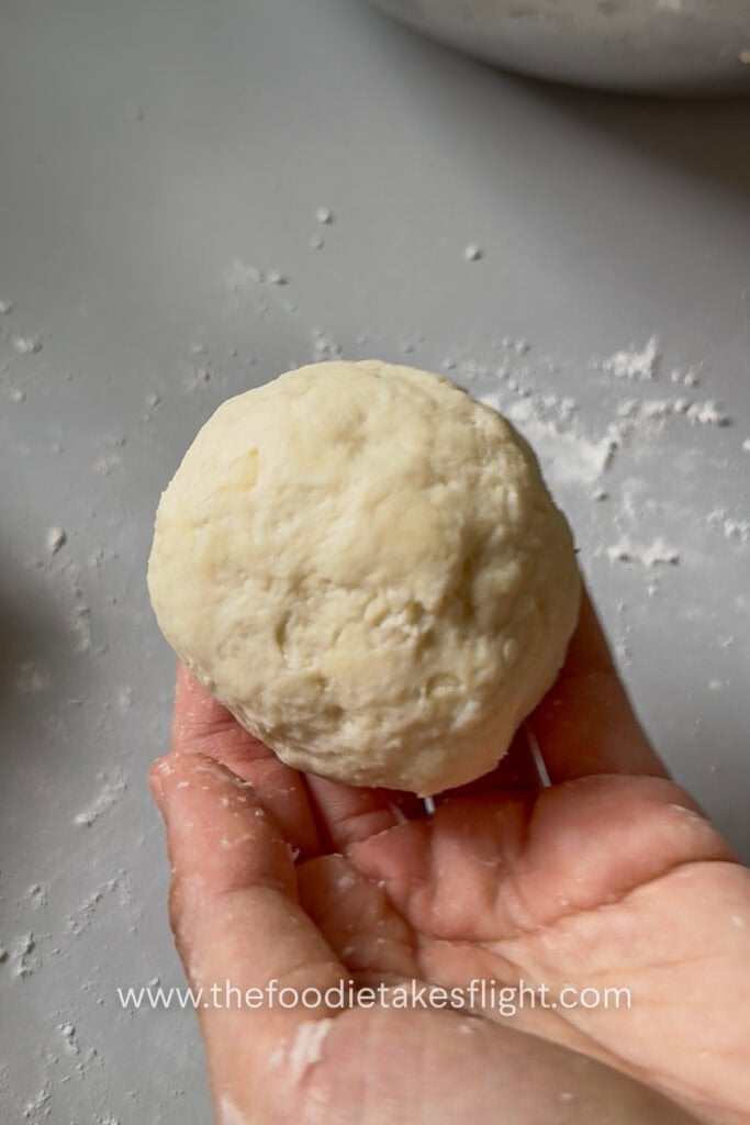 Pita dough divided into small balls before rolling into flatbreads