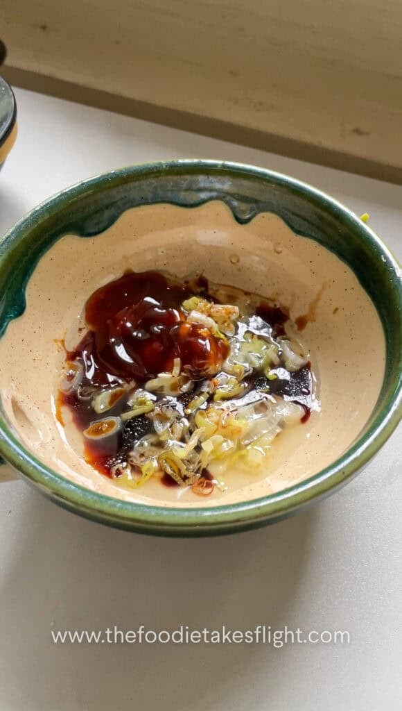 Sweet and spicy tofu sauce mixed with garlic, soy sauce, vegetarian oyster sauce, sugar, rice vinegar, and chili oil