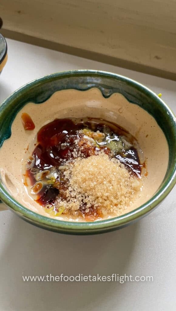 Sweet and spicy tofu sauce mixed with garlic, soy sauce, vegetarian oyster sauce, sugar, rice vinegar, and chili oil