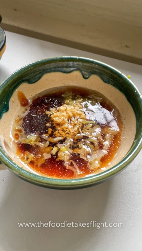 Sweet and spicy tofu sauce mixed with garlic, soy sauce, vegetarian oyster sauce, sugar, rice vinegar, and chili oil