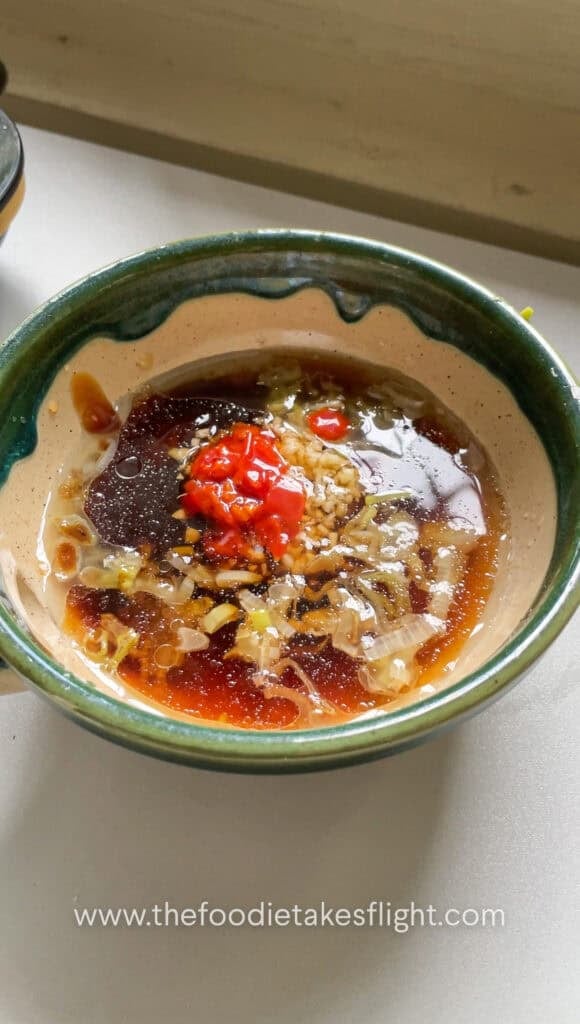 Sweet and spicy tofu sauce mixed with garlic, soy sauce, vegetarian oyster sauce, sugar, rice vinegar, and chili oil
