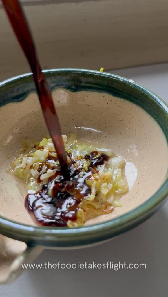 Sweet and spicy tofu sauce mixed with garlic, soy sauce, vegetarian oyster sauce, sugar, rice vinegar, and chili oil
