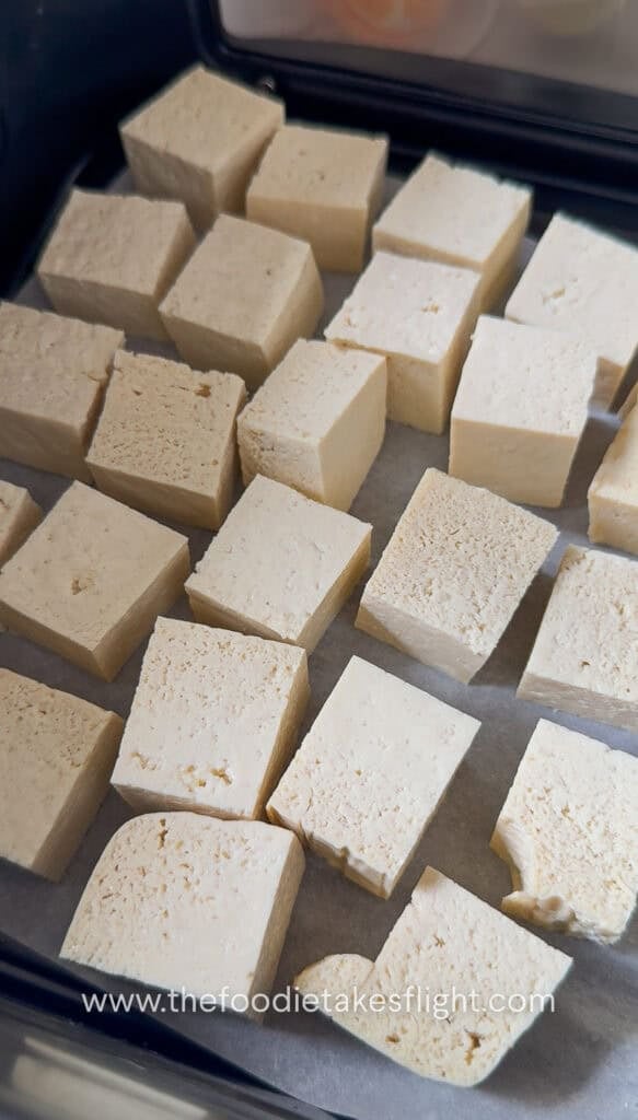 Tofu cubes laid out on an air fryer