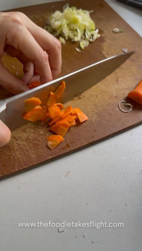 Carrot peeled, quartered, and thinly sliced