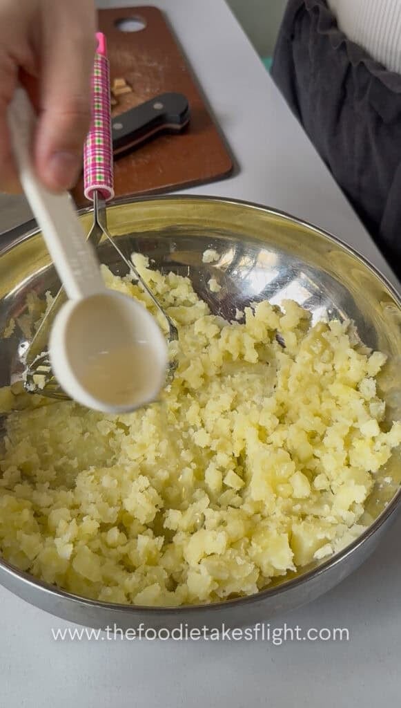 Hot potatoes mashed and seasoned with rice vinegar, salt, and pepper