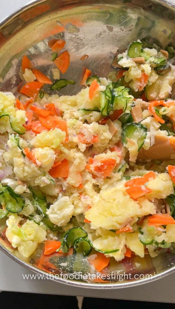 Japanese potato salad mixed until creamy with visible chunks of potato