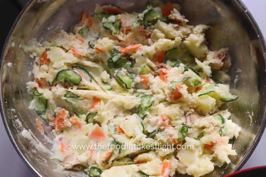 Japanese potato salad mixed until creamy with visible chunks of potato