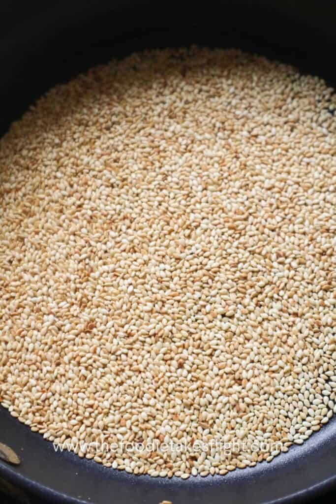 Sesame seeds toasted in a pan until lightly golden and fragrant