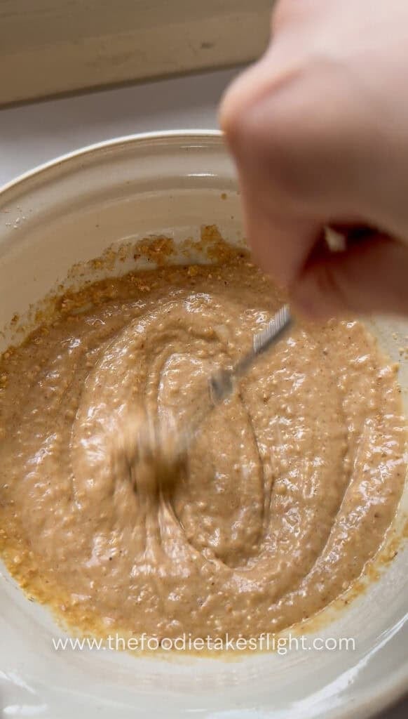 Egg-free Kewpie mayo, rice vinegar, soy sauce, sugar, water, and sesame oil mixed in a bowl