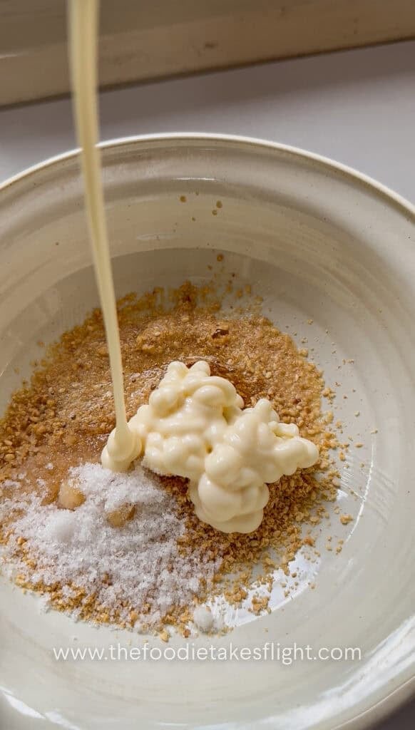 Egg-free Kewpie mayo, rice vinegar, soy sauce, sugar, water, and sesame oil mixed in a bowl