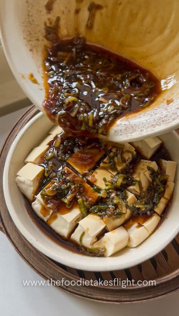 Ginger scallion sauce poured over steamed silken tofu