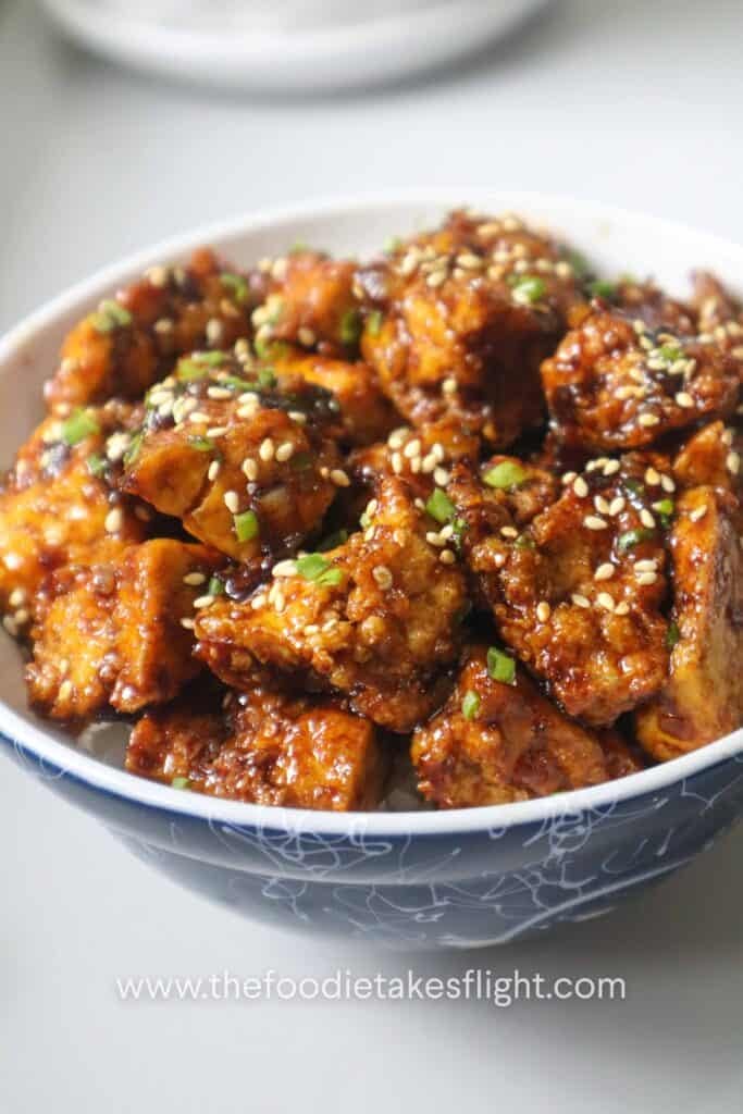 sticky tofu rice bowl recipe with crispy hand-torn tofu in glossy hoisin sauce over steamed rice