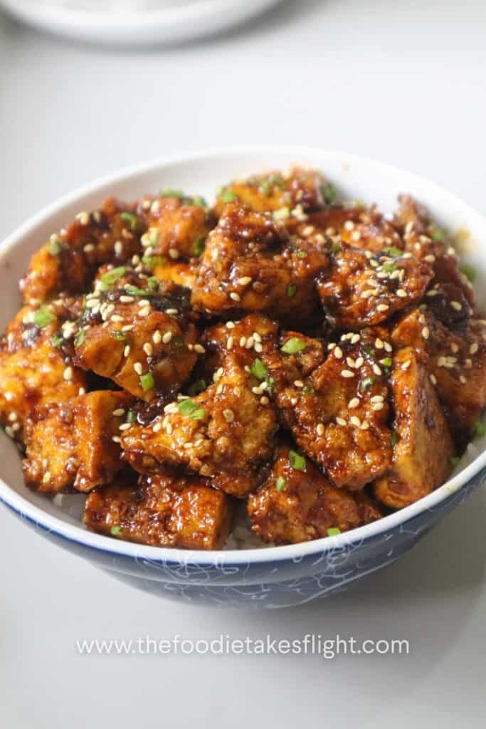 sticky tofu rice bowl recipe with crispy hand-torn tofu in glossy hoisin sauce over steamed rice