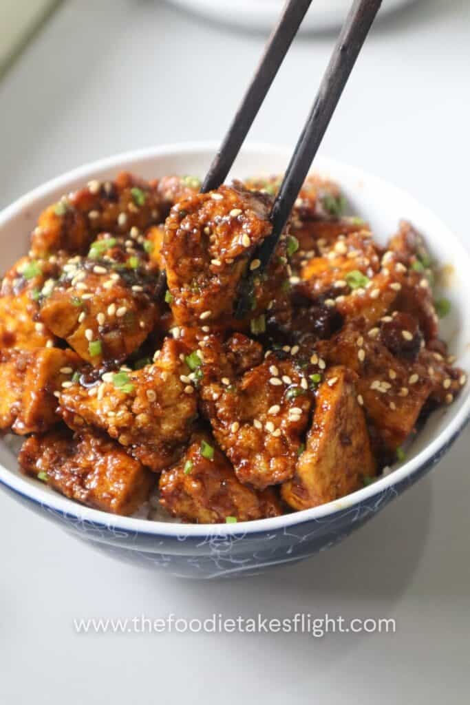 sticky tofu rice bowl recipe with crispy hand-torn tofu in glossy hoisin sauce over steamed rice