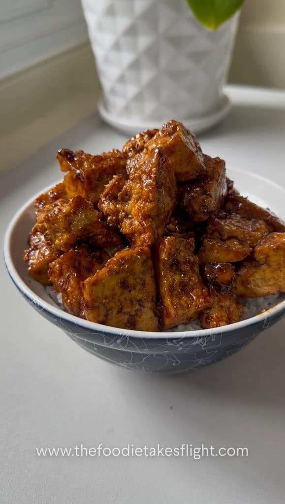 sticky tofu rice bowl recipe with crispy hand-torn tofu in glossy hoisin sauce over steamed rice
