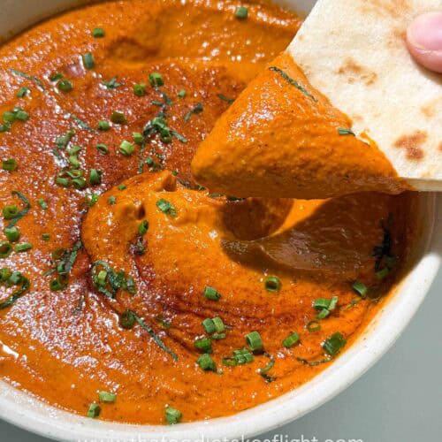 roasted red pepper dip in a bowl with pita